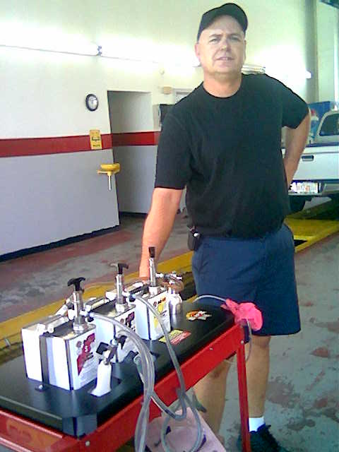 Jiffylube Mgr. all smiles with Mega Powe FISC Cart Jiffylube Mgr. all smiles with Mega Powe FISC Cart