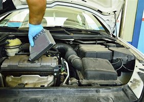 pic shows person adding Mega Power Brand coolant additive to engine
